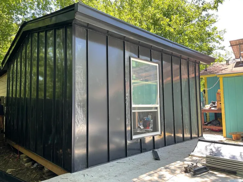 Black standing seam metal wall panels for Roof Inspection in Palm Harbor