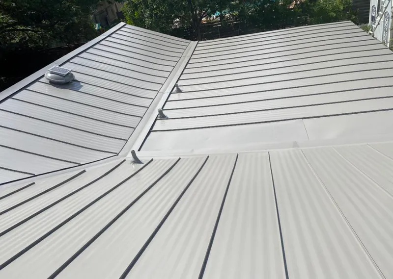 Solar attic fan installed on a metal roof for Roof Ventilation in Palm Harbor